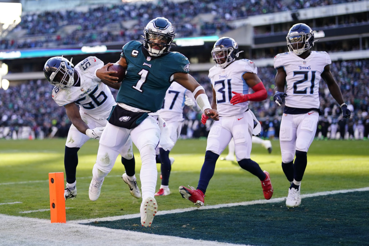 Philadelphia Eagles’ Jalen Hurts scores a touchdown during the first half of an NFL football game against the Tennessee Titans, Sunday, Dec. 4, 2022, in Philadelphia.